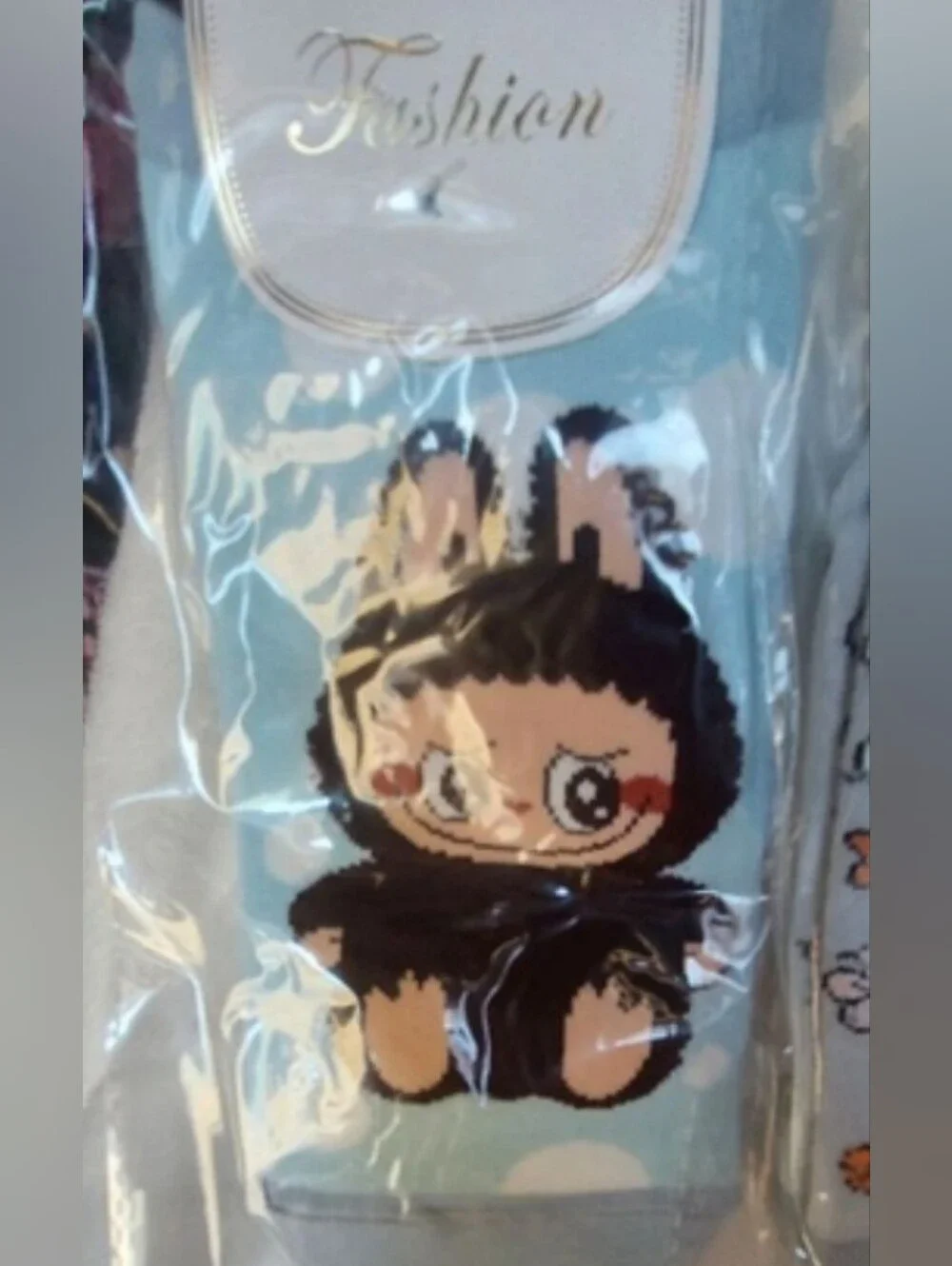 5 pairs of the ugly but cute Labubu Character footies Socks.